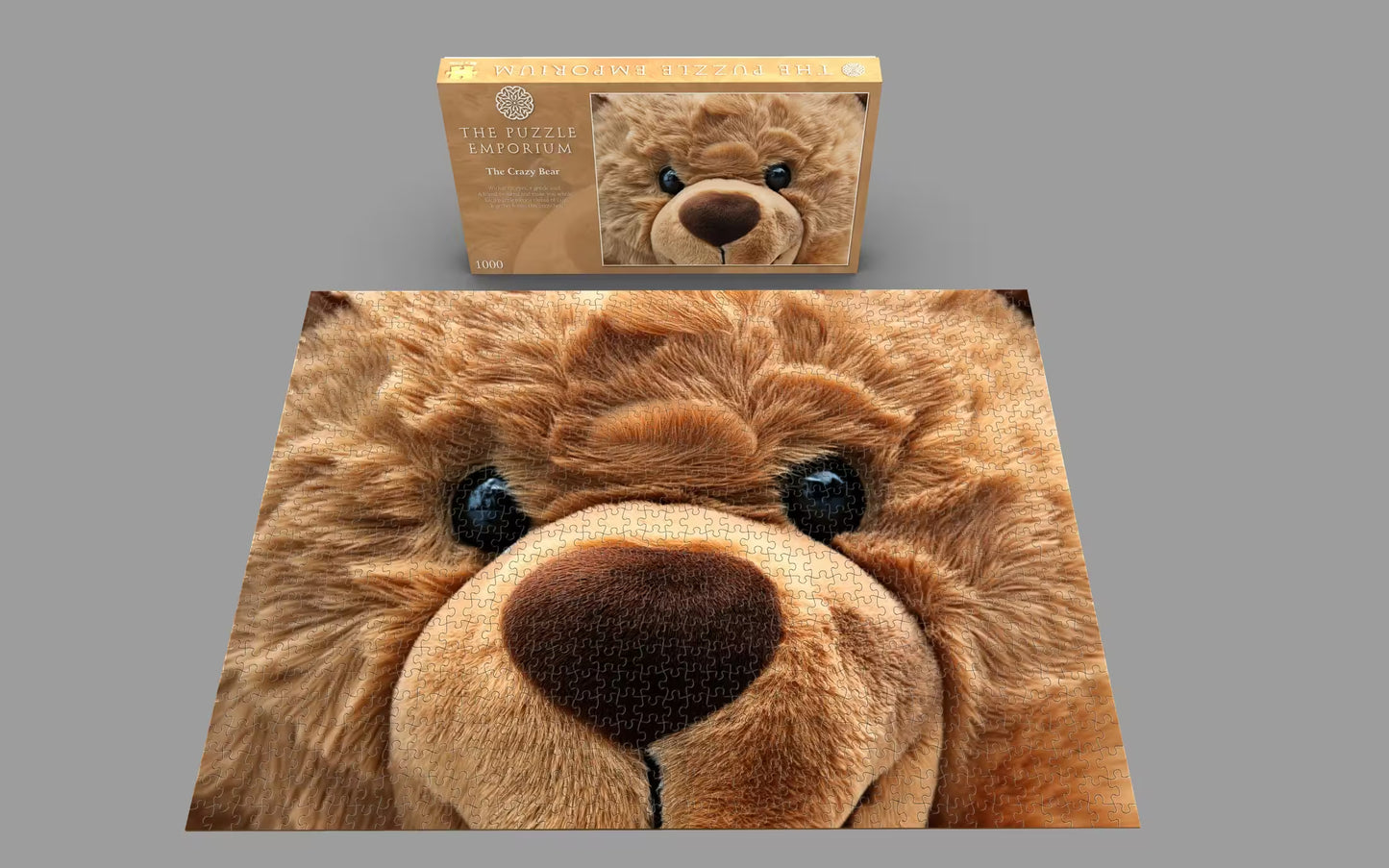 Close-up of a plush teddy bear with a cardboard box featuring the same teddy bear design on a gray background.