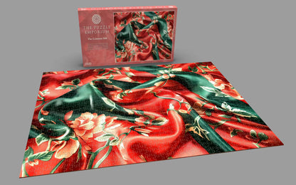 Jigsaw puzzle with floral design and packaging on a gray background