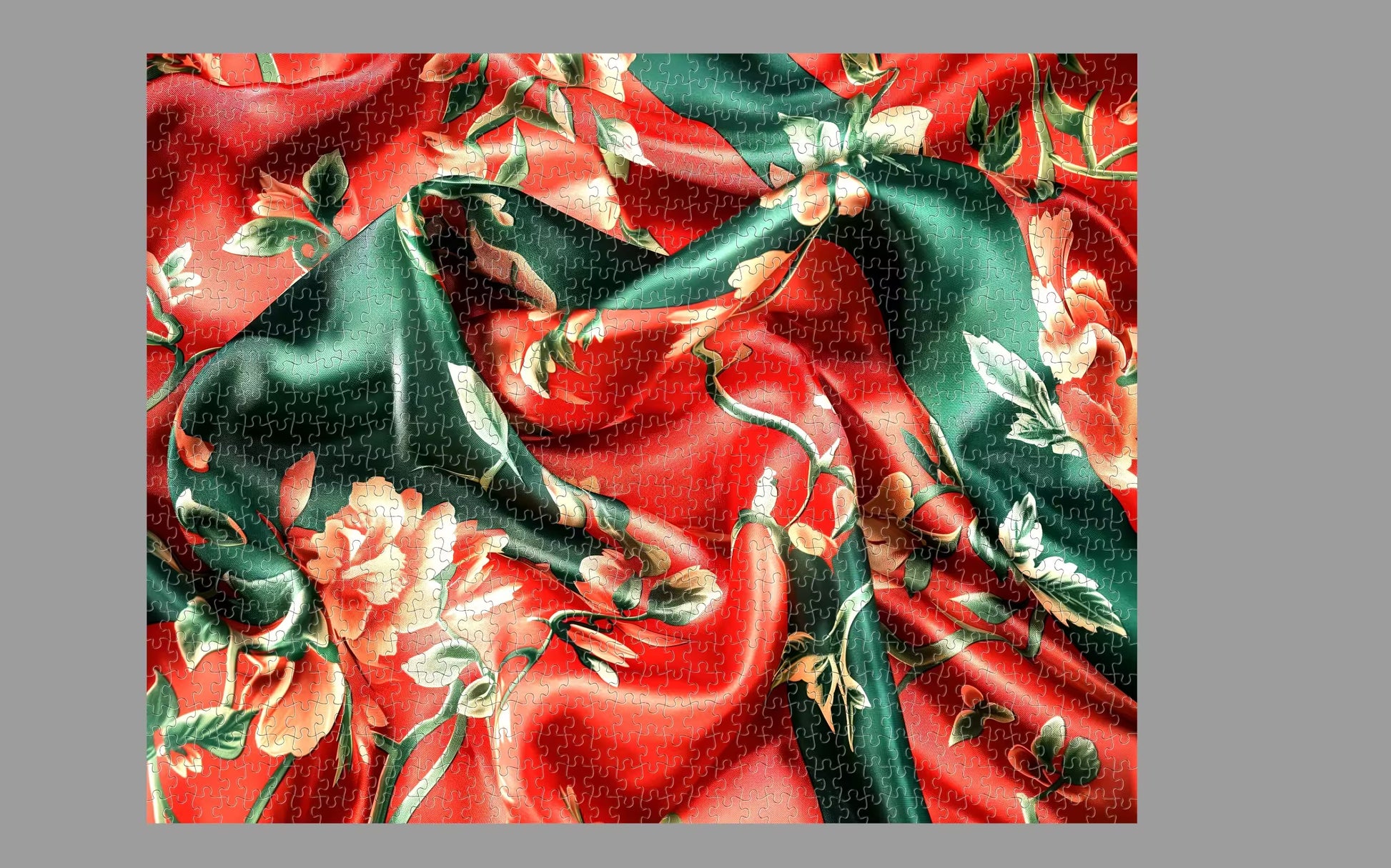 Floral fabric pattern with green leaves and red flowers on a red background