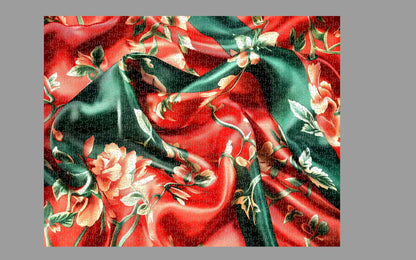 Floral fabric pattern with green leaves and red flowers on a red background