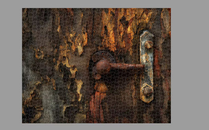Rust-covered metal latch on a textured surface