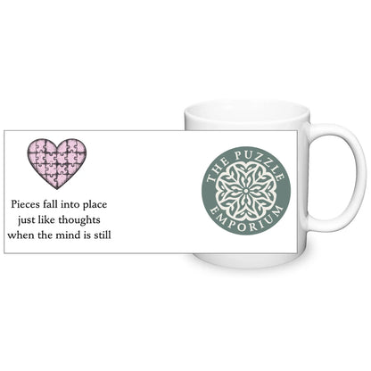 White mug with a heart design and text on a white background