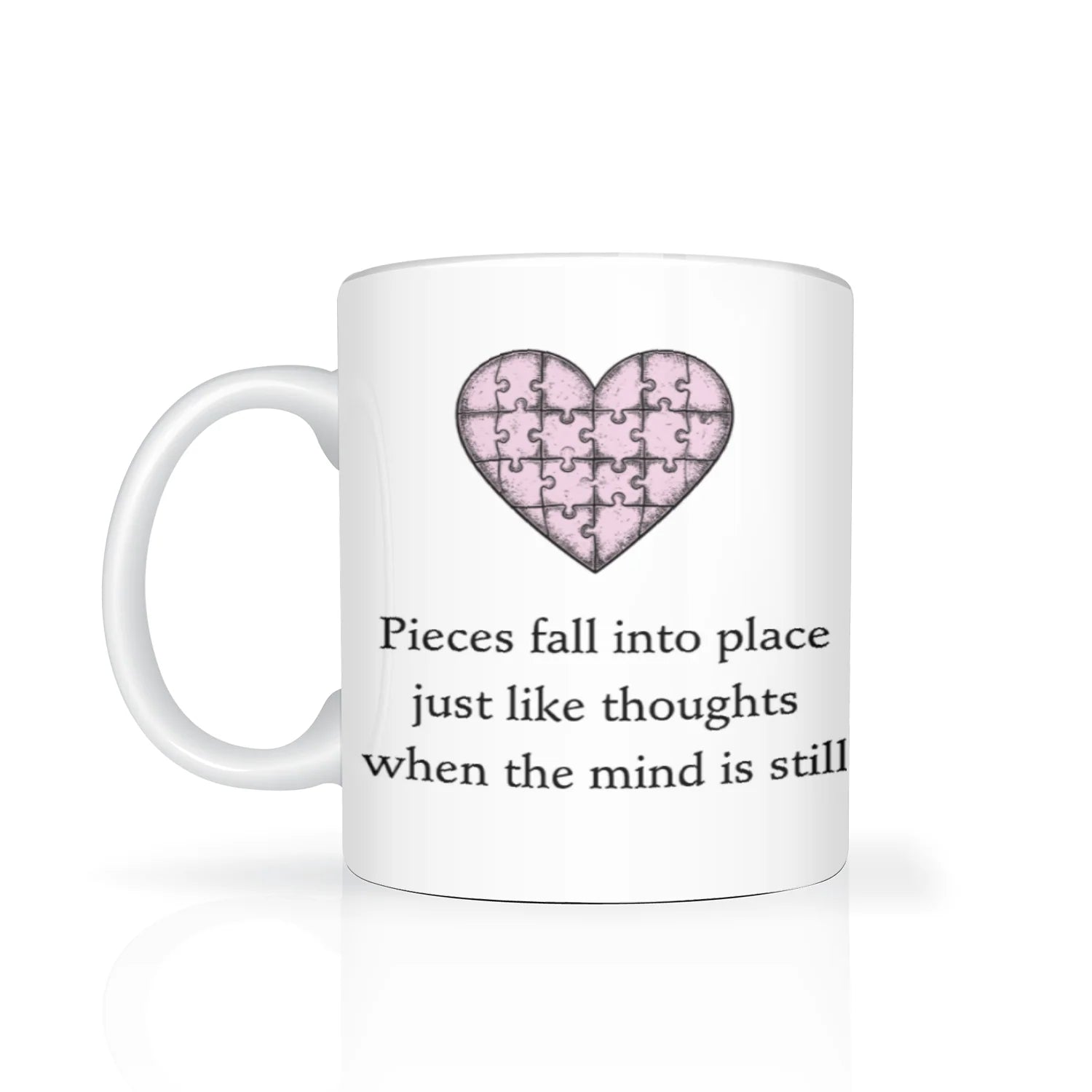 White mug with pink heart puzzle design and text on a white background