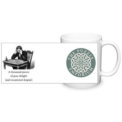 "a thousand pieces of pure delight (and occasional dispair)" text and logo on white ceramic mug