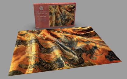 Puzzle with dragon design and packaging on a gray background