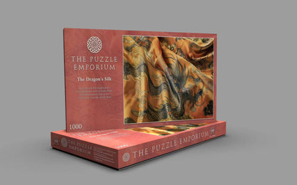 Jigsaw puzzle box from The Puzzle Emporium with dragon design on gray background