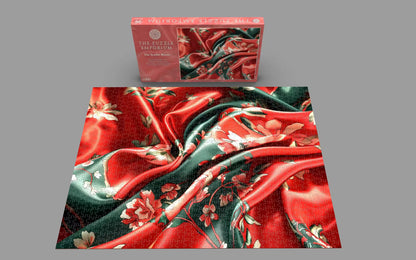 Jigsaw puzzle with red and green floral design on a gray background