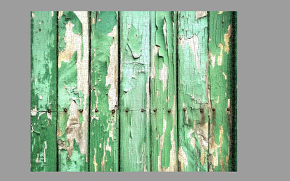Rustic wooden panel with peeling green paint