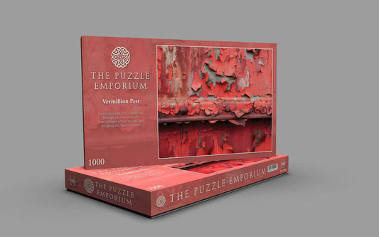 Red puzzle box from The Puzzle Emporium on a gray background