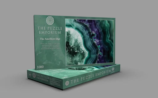 Jigsaw puzzle box from The Puzzle Emporium with an amethyst design on a gray background