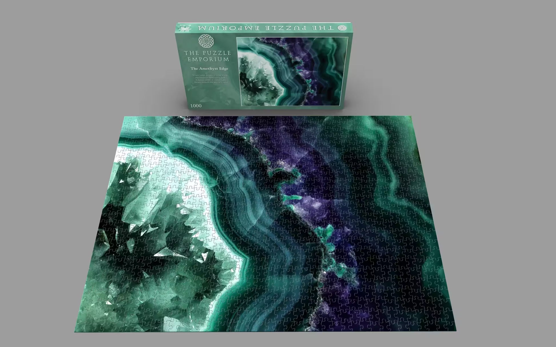 Jigsaw puzzle with geode design and packaging on a gray background